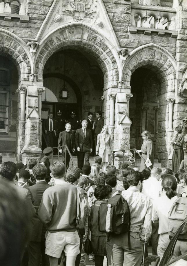 In October 1991, Georgetown University President Leo O'Donovan, S.J., Arkansas Governor Bill Clinton and his wife Hillary leave Healy Building at Georgetown University.