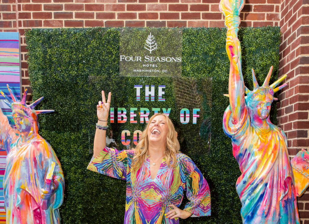 Liberty-loving artist Maggie O’Neill at the Bourbon Steak Patio invites guests to “Pledge Allegiance to Color.” Courtesy Four Seasons.